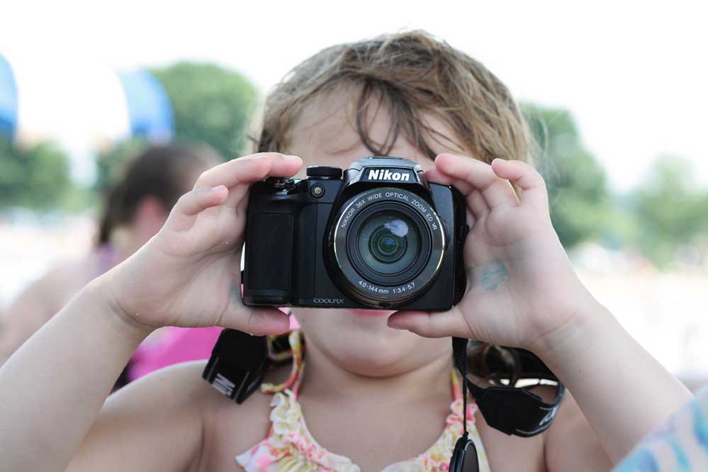 photography for kids- child with camera
