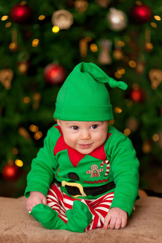 baby near christmas tree