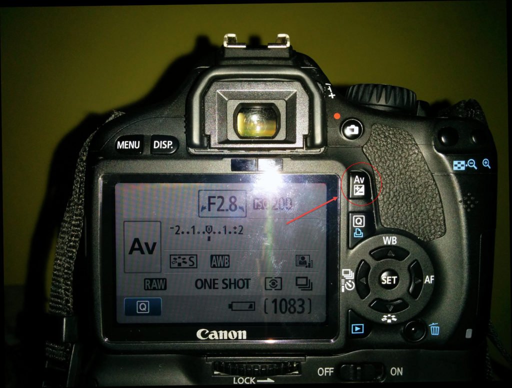 Camera exposure compensation button Canon